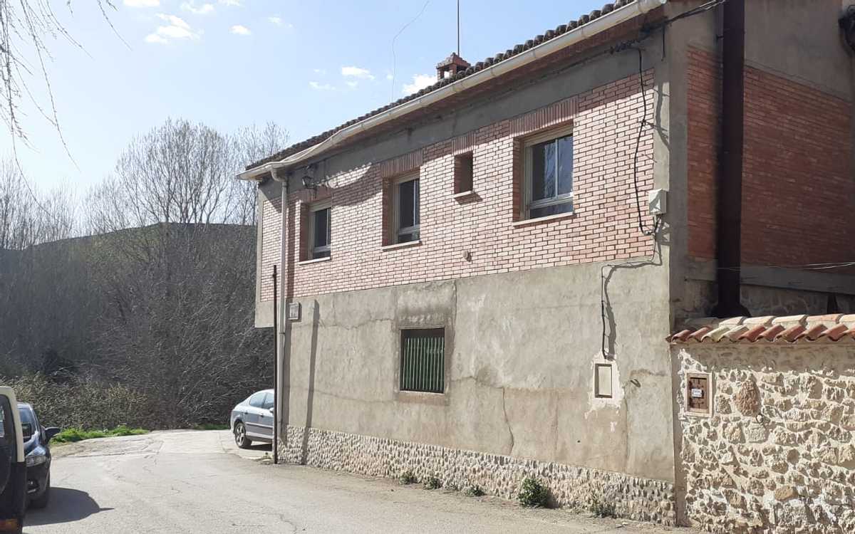 Village house with large garage and storage